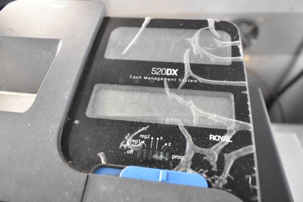 Royal 520DX countertop electronic cash register, visible wear, 120 volts, 1 phase, showing control panel and markings.