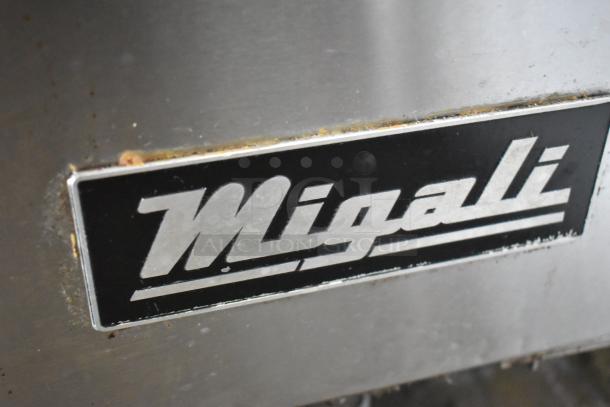 Migali C-U72R stainless steel undercounter cooler, 3 doors, commercial casters, 115V, 1 Phase. Logo detail shown.