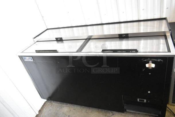 Arctic Air AUB65RZ commercial back bar bottle cooler with 2 sliding lids and commercial casters, 115 volts, 1 phase.