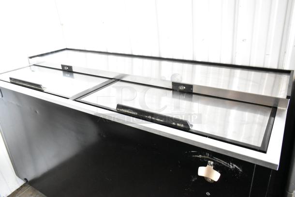 Arctic Air AUB65RZ metal commercial back bar bottle cooler with 2 sliding lids, on casters; 115 volts, 1 phase.