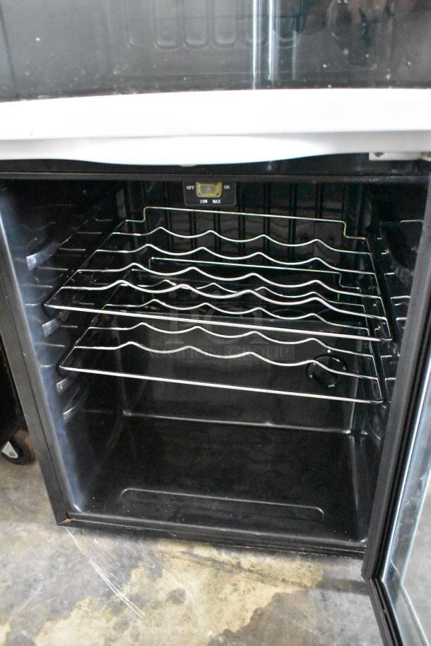Avanti WC330DZB metal mini cooler merchandiser, interior view, features wire racks, used condition, 115V, 1 phase.
