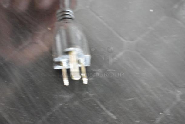 The image shows the power plug of the Avanti WC330DZB Metal Mini Cooler Merchandiser.