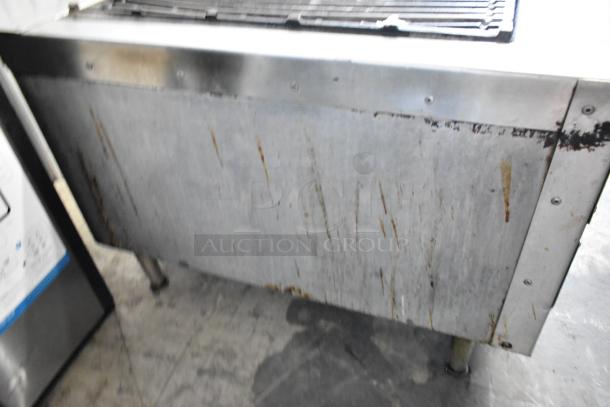 Attias stainless steel commercial gas charbroiler grill, countertop model; visible wear and stains on exterior.