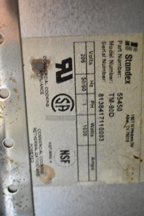 Standex TM-90D steam table label showing model, part number, voltage, phase, and NSF certification.
