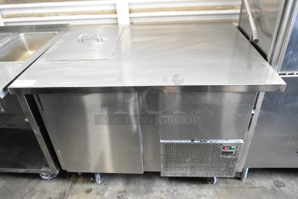 Stainless steel commercial prep table with 2 doors, on casters. 115 volts, 1 phase. Excellent condition.