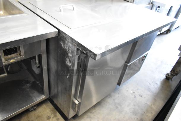 Stainless steel commercial prep table with two doors, on casters. 115V, 1 phase. Moderate use condition.