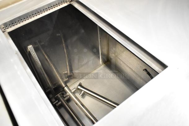 Stainless steel commercial prep table with open storage area, two doors on commercial casters, 115 volts, 1 phase.