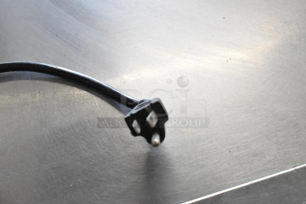 Stainless steel prep table with two doors on casters, 115 volts, 1 phase, commercial-grade, durable and mobile.