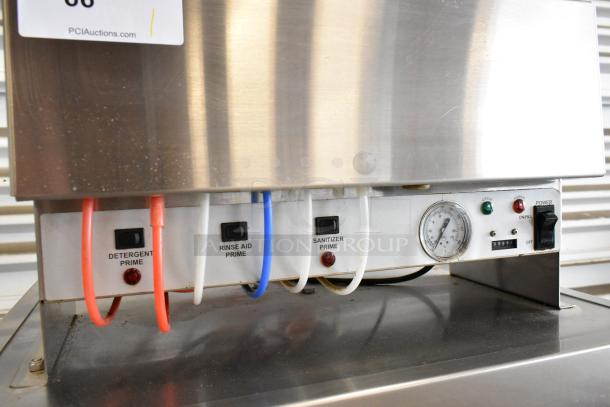 Noble Wareforce I-E stainless steel low temp dishwasher, showing detergent, rinse aid, sanitizer controls, and power switch.