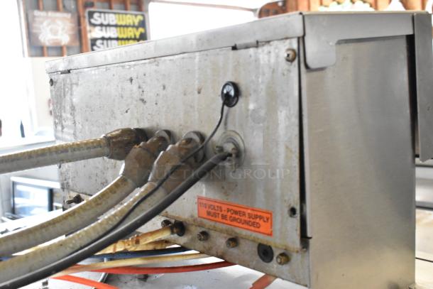 Noble Wareforce I-E dishwasher, stainless steel, low temp, lo-pass, 115 volts, 1 phase. Tags indicate power must be grounded.