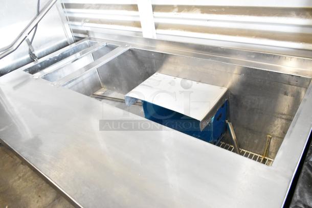 Universal Coolers stainless steel commercial prep table with commercial casters, 115 volts, 1 phase.
