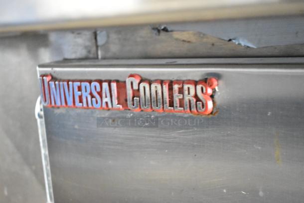 Universal Coolers stainless steel commercial prep table, visible logo. Features commercial casters, 115V, 1 phase.