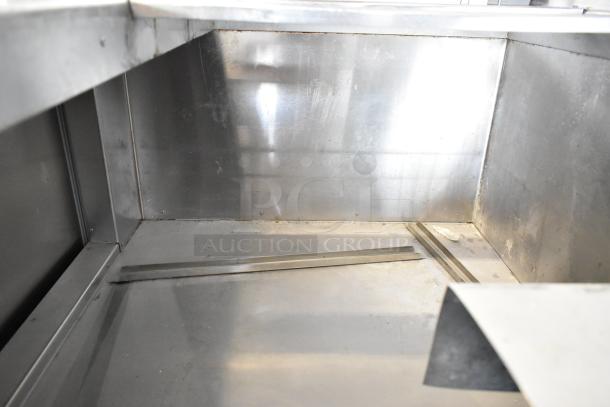 Universal Coolers stainless steel commercial prep table on casters, showing inside view. Runs on 115 volts, 1 phase.