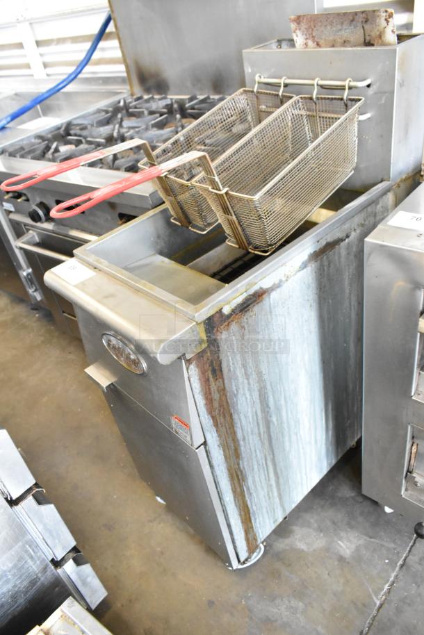 Entree F3-N stainless steel commercial deep fat fryer, natural gas powered, with 2 metal fry baskets, visible wear.