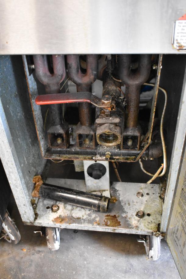Entree F3-N Stainless Steel Commercial Gas Deep Fryer, 90,000 BTU, with 2 metal baskets. Visible internal components, used condition.