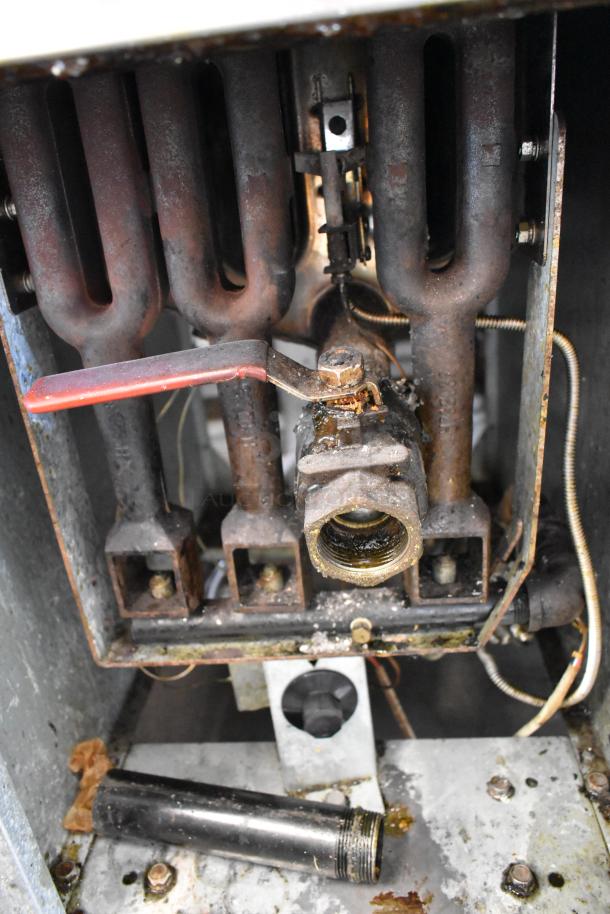 Entree F3-N Stainless Steel Natural Gas Fryer, 90,000 BTU, internal view, visible pipes and components, needs cleaning.