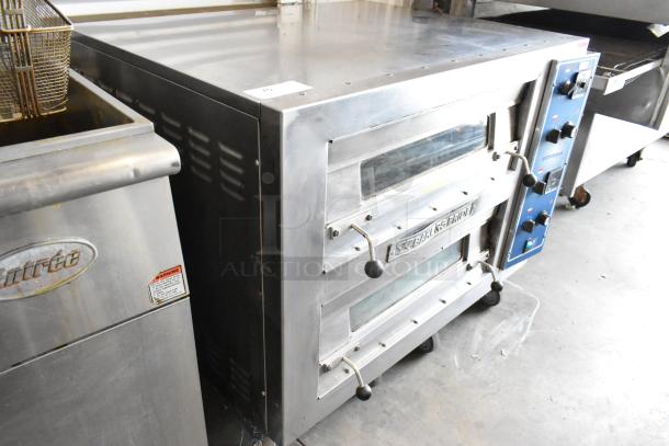 2021 Bakers Pride EP-2-2828 SuperDeck stainless steel 2-deck pizza oven, broken cooking stones, 208V, 1 phase.