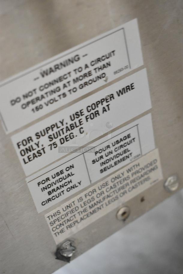 Bakers Pride EP-2-2828 SuperDeck stainless steel commercial pizza oven; 208V, 1 phase; label shows wiring specs; broken stones.