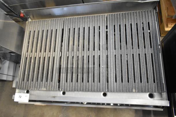 EmberGlo Stainless Steel Commercial Charbroiler Grill, countertop model with cast iron grates. Visible grime indicates usage.