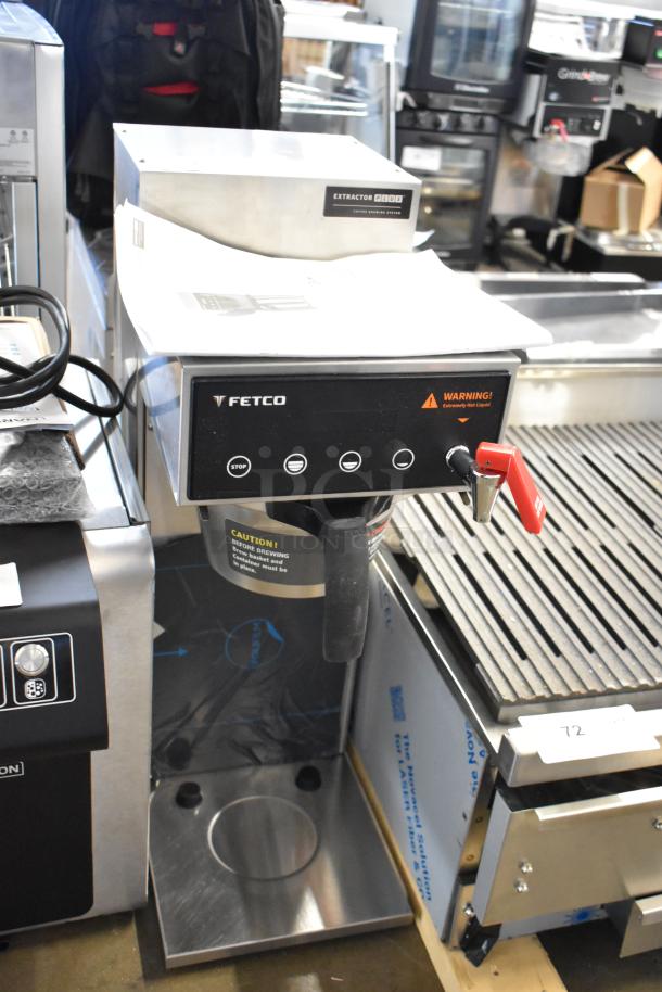 2025 Fetco CBS-1221 stainless steel commercial coffee machine with hot water dispenser. Features metal brew basket.
