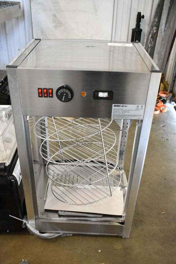 Brand new ServIt 423PDW12D1 stainless steel 12" pizza warmer with 4-shelf rotating rack. Scratch and dent condition.
