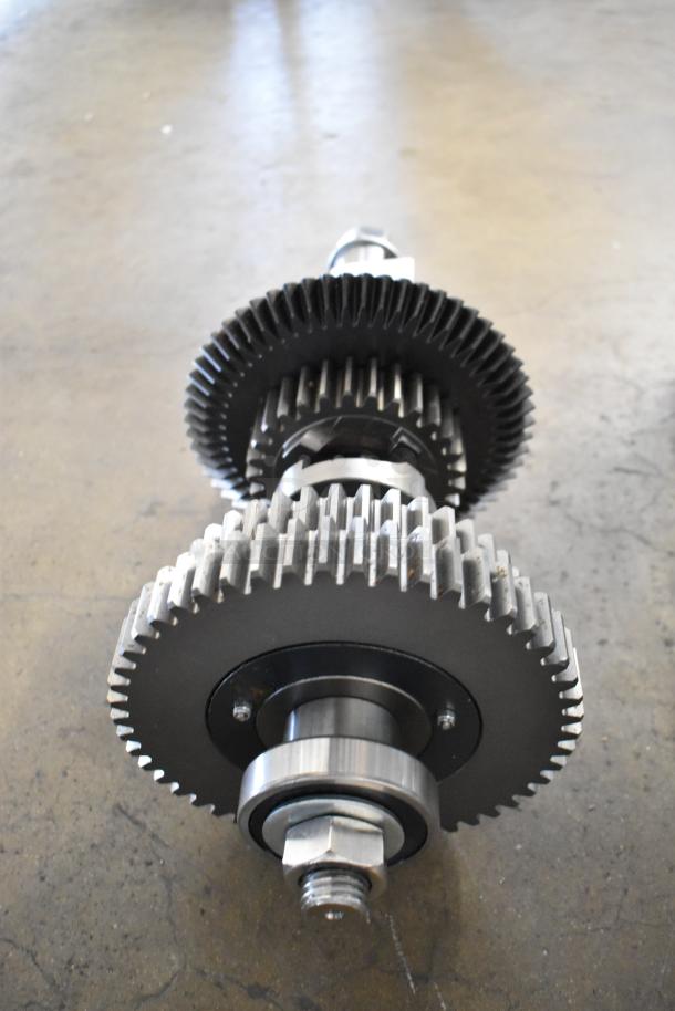 BRAND NEW SCRATCH AND DENT metal unit with dual gears and secure bolts, showcasing minor cosmetic blemishes.