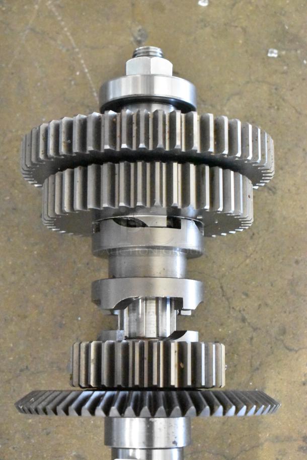 BRAND NEW SCRATCH AND DENT metal unit with visible gears; slight imperfections, robust construction, industrial use.