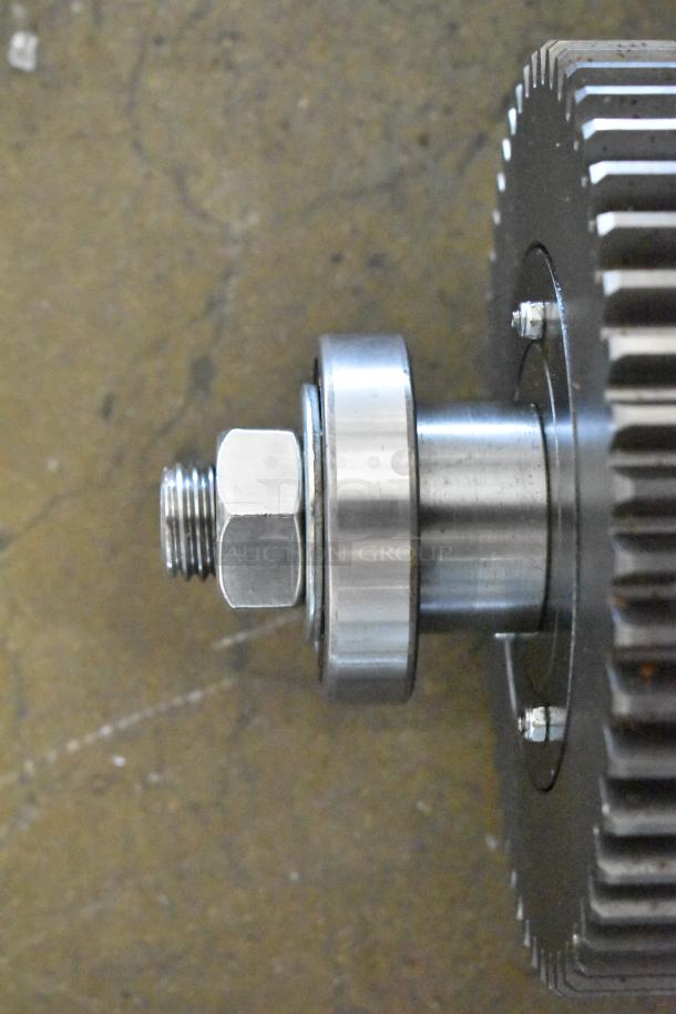 Brand new metal unit, scratch and dent condition, features a gear with hex bolt, steel construction.