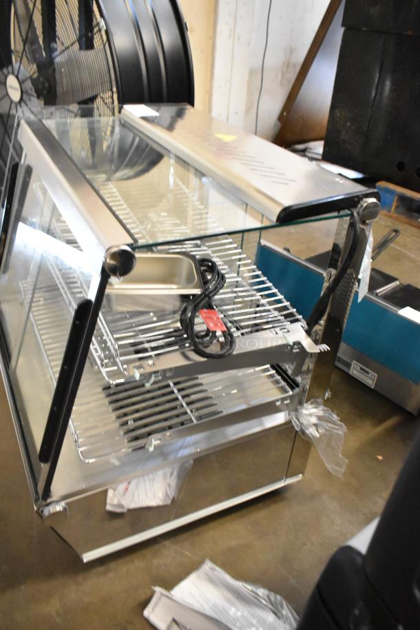 ServIt 423HDM26SA stainless steel heated display case, 26", 3 shelves, new with broken glass, missing rear doors, 120V, 1 phase.