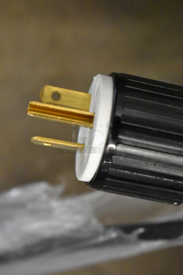 Close-up of a black and white electrical plug for ServIt 423HDM26SA countertop heated display case, 120 volts, 1 phase.