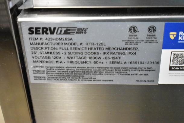 Stainless steel heated display case, ServIt 423HDM26SA, 26", with 3 shelves. Note: broken glass, missing rear doors, 120V, 1 phase.