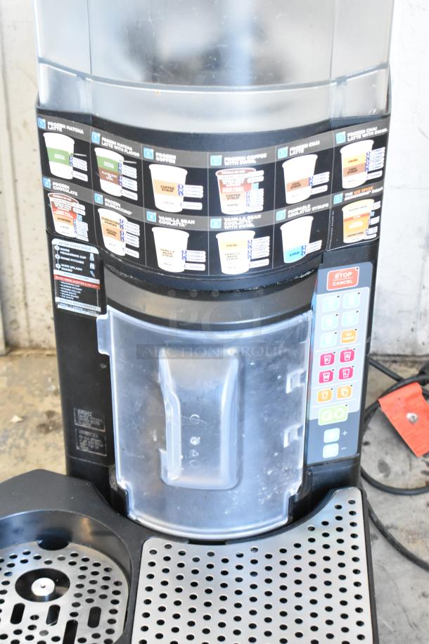Taylor X83684-12 frozen beverage mixer, commercial countertop model, control panel, drink options, good condition.
