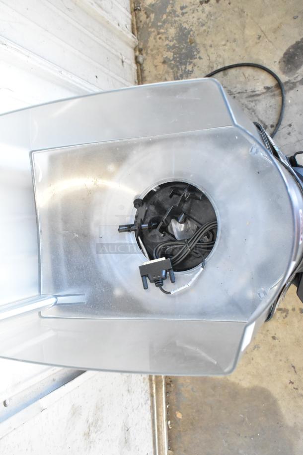 Taylor X83684-12 metal commercial countertop frozen beverage mixer, silver, intact interior view, includes power cord.