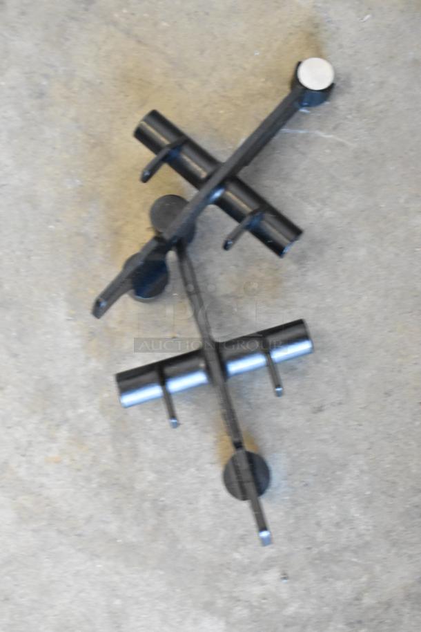 Taylor X83684-12 metal components for commercial frozen beverage mixing machine on concrete floor.