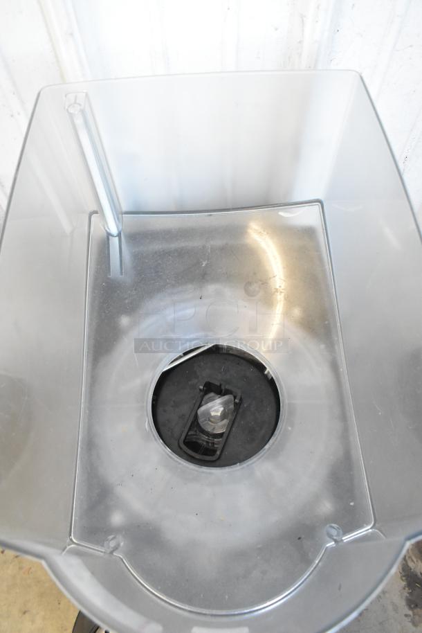 Taylor X83684-12 Metal Commercial Countertop Frozen Beverage Mixing Machine, clean interior, visible mixing blade.