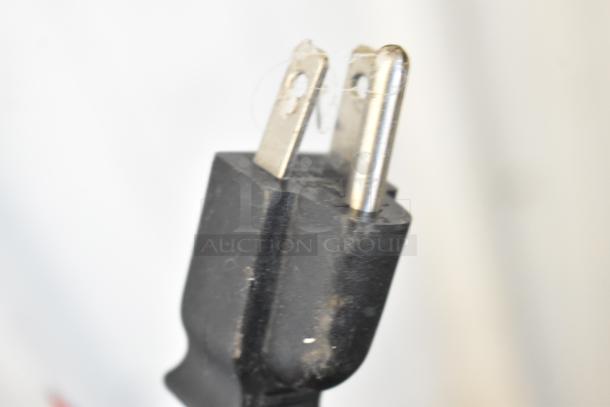 Close-up of a power plug for the Taylor X83684-12 Metal Commercial Countertop Frozen Beverage Mixing Machine.