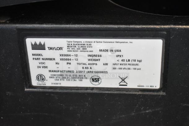 Taylor X83684-12 metal commercial countertop frozen beverage mixing machine label, showing specs and certification.