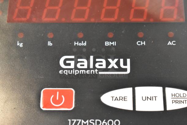 Galaxy 177MSD600 metal floor style scale with digital display, tare and unit functions, and power button.