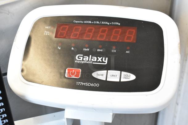Galaxy 177MSD600 metal floor scale, capacity 600lb/300kg, digital display, tare and unit buttons, minor wear.