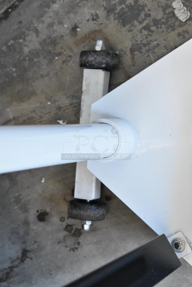 Galaxy 177MSD600 metal floor scale, white finish, sturdy wheels, in good condition, ideal for precise weighing.