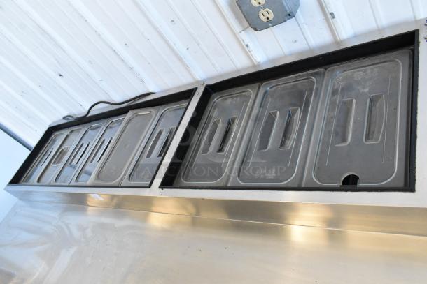 2018 Atosa MPF8202GR stainless steel pizza prep table, commercial casters, covered container tops shown.