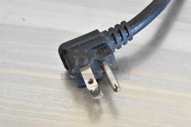 Three-prong plug of a 2018 Atosa MPF8202GR stainless steel pizza prep table; shows standard U.S. electrical connection.