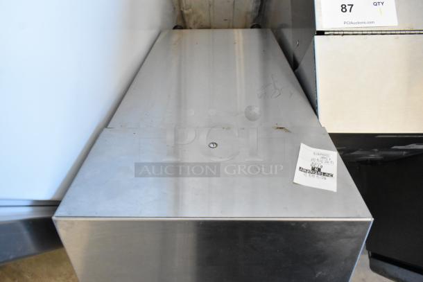 Bunn ICDD-3 Stainless Steel Reservoir Stand, showing surface wear. Model ICDD-3 visible. Rugged construction for commercial use.