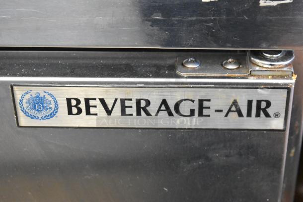 Beverage Air SPE48C stainless steel commercial prep table, logo plate detail, on casters, 115V, 1 phase.