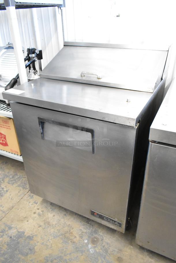 True TSSU-27-08 stainless steel sandwich salad prep table, commercial casters, 115 volts, 1 phase, good condition.
