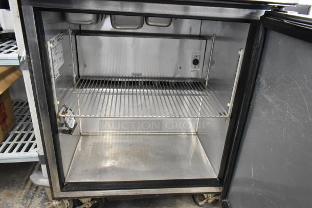 True TSSU-27-08 stainless steel prep table, open view. Clean interior, single shelf, commercial casters, 115V, 1 phase.