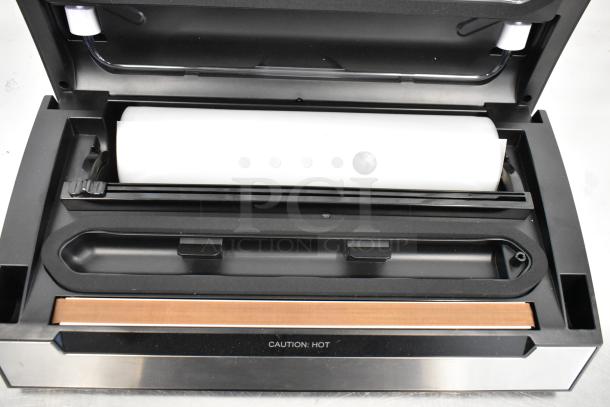 2024 VacPak-It 186VSM12PRO vacuum sealer with 12" seal bar, cutter, and roll holder. Features "Caution: Hot" label.