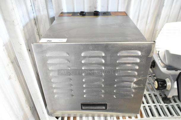 Weston Stainless Steel Countertop Dehydrator, 120 Volts, 1 Phase, in good condition with vented design and control panel.