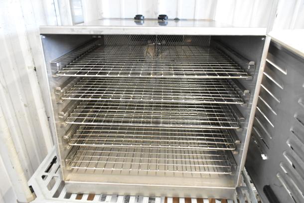 Weston stainless steel countertop dehydrator with multiple wire racks, 120 volts, 1 phase, in good condition.