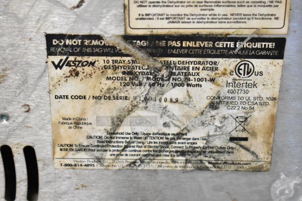 Weston Stainless Steel Dehydrator label showing model 74-1001-W, 120V, 1000W. Label is worn with visible stains.